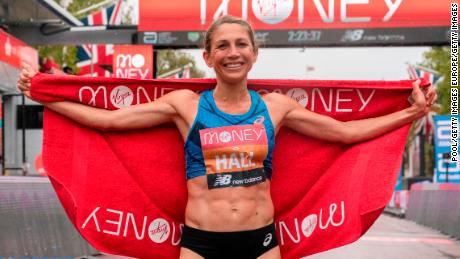 Hall celebrates her performance at the London Marathon finish line. 