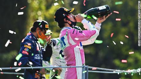 Lance Stroll (right) celebrates on the podium at this year&#39;s Italian GP.