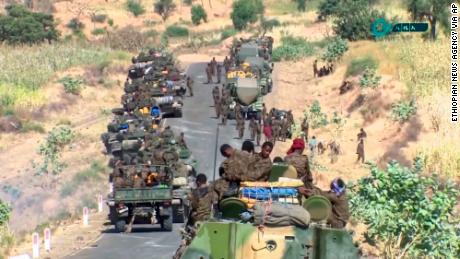 This image, made from undated handout video released by the state-owned Ethiopian News Agency on November 16, 2020, shows Ethiopian military gathered on a road in an area near the border of the Tigray and Amhara regions of Ethiopia. 