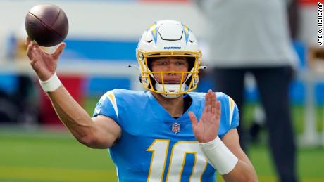 Many had seen the battle for the Offensive Rookie of the Year award as a straight shoot-out between Burrow and the LA Chargers&#39; Justin Herbert (pictured).