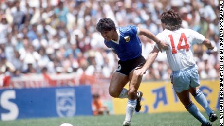 Diego Maradona beats England defender Terry Fenwick on his way to scoring his outstanding individual second goal in the 1986 World Cup quarterfinal.