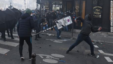 Demonstrators clash with police during a protest against the &quot;global security&quot; draft law in Paris, on Saturday, November 28, 2020.