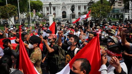 People demonstrate in favor of democracy and against corruption outside Congress in Lima, Peru, on November 16.