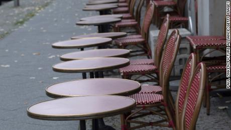 Empty tables and chairs stand in front of a restaurant in Berlin. Germany is under partial lockdown in November.