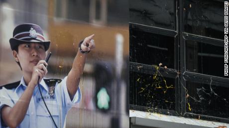 A poster of a policewoman is seen as protesters throw eggs and bricks outside a police station in the Tseung Kwan O district in Hong Kong on August 4, 2019.