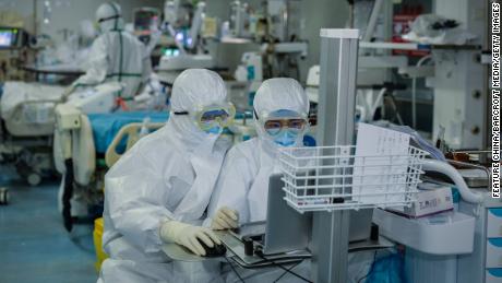 Medical personnel work in the intensive care unit at a Wuhan hospital on February 24.