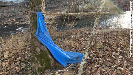 The creekbed and tarp where Jordan Gorman was found, about three-quarters of a mile from his home.