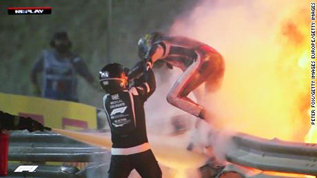 Romain Grosjean emerges from the flames of the crash.