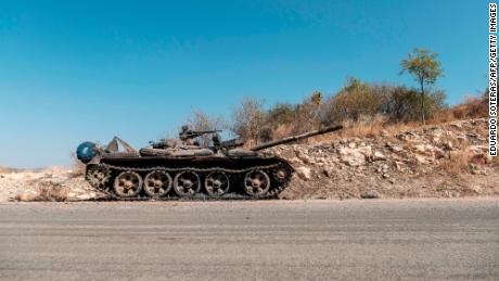 A damaged tank stands abandoned on a road near Humera, Ethiopia, on November 22, 2020