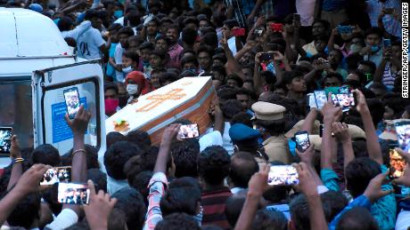 Residents gather as they carry the coffin of Jayaraj and son Bennicks, who were allegedly tortured at the hands of police in Sathankulam.