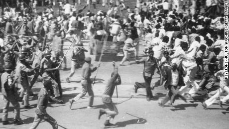 Police using lathis -- heavy wooden staves tipped with iron -- to break up a march against high poverty levels on March 14, 1978.