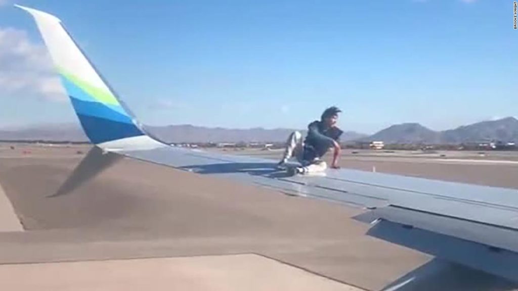 Las Vegas airport: Man taken into custody after he climbed onto the wing of an airplane preparing to takeoff