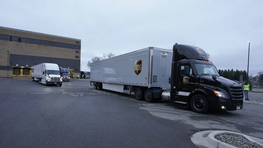 Trucks containing the Pfizer-BioNTech Covid-19 vaccine leave the Pfizer manufacturing plant in Kalamazoo, Michigan, on December 13.