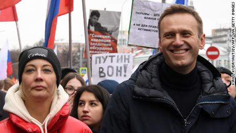 Alexey Navalny and his wife, Yulia, march in memory of slain Kremlin critic Boris Nemtsov in Moscow in 2019. Yulia became ill during a vacation in Kaliningrad.
