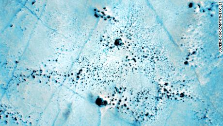 Melt holes caused by bacteria are another threat to Greenland&#39;s ice sheet. The largest of these is approximately 20 inches in diameter.