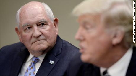 Agriculture Secretary Sonny Perdue listens as US President Donald speaks during a roundtable with farmers in the Roosevelt Room of the White House on April 25, 2017 in Washington, DC. During the meeting Trump signed the Executive Order Promoting Agriculture and Rural Prosperity in America. (Photo by Olivier Douliery/Pool/Getty Images)