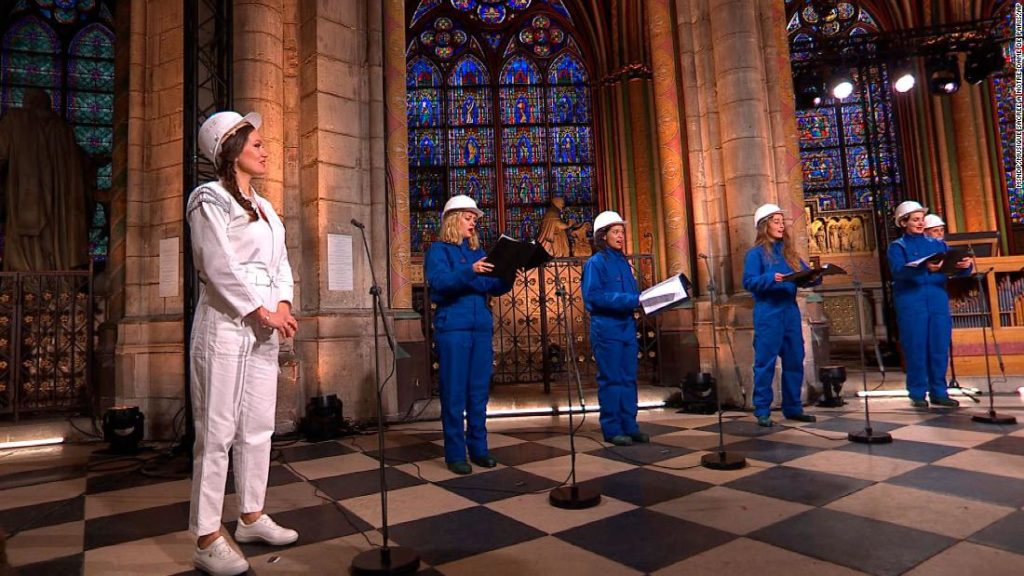 With choir in hard hats, fire-ravaged Notre Dame rings in Christmas