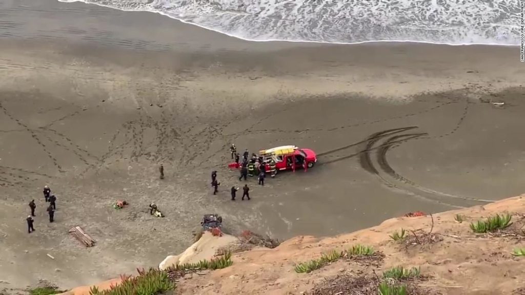 Woman survives car crash off a cliff, landing on San Francisco beach