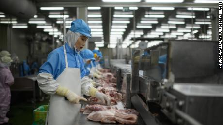 In this photo, taken on August 28, 2018, cuts of meat are processed at a Spam factory in Jincheon, South Korea. 