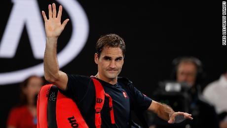 Federer acknowledges the crowd as he walks off court after losing against Djokovic at the Australian Open earlier this year.