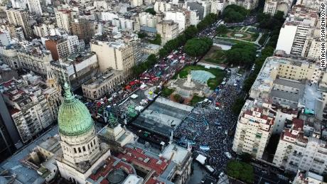 Abortion-rights activists, left, and activists against abortion, right, rally outside Argentina&#39;s Congress in the capitol of Buenos Aires on Tuesday as lawmakers debated a bill that legalized abortion. 