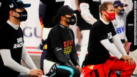Hamilton along with some of his fellow F1 drivers take a knee on the grid in support of the Black Lives Matter movement prior to the F1 Grand Prix of Bahrain.