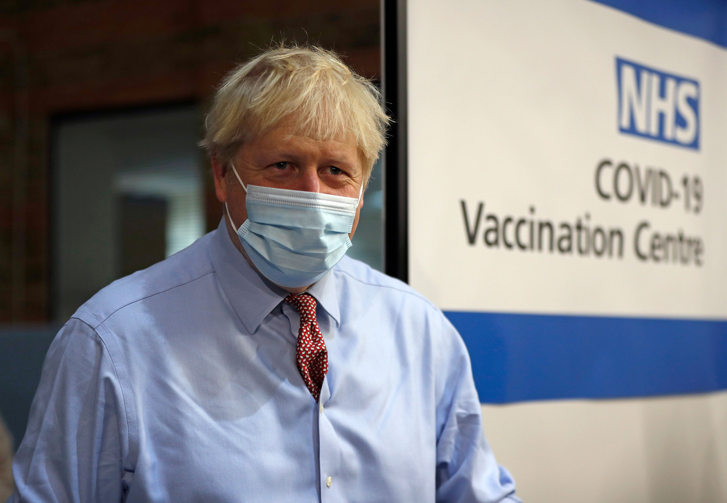 Britain “can’t afford to relax now,” PM says during visit to newly-opened London vaccine center