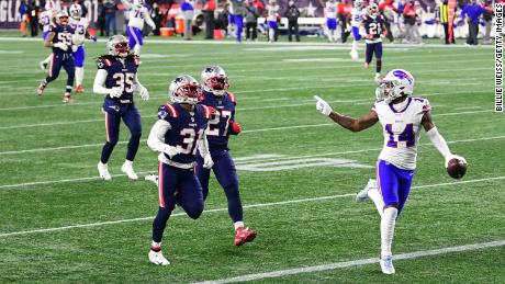 Diggs taunts New England Patriots defenders as he runs into the end zone for a touchdown.