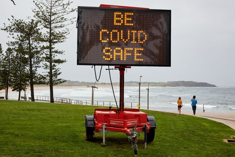 A Covid-19 digital sign is seen on Dee Why beachfront on December 19, in Sydney, Australia.