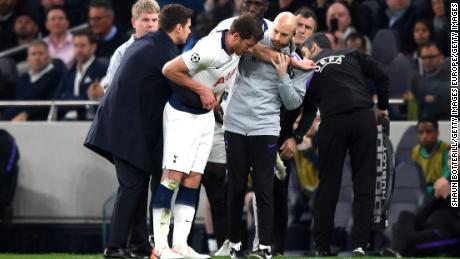 Vertonghen is helped from the field during Tottenham&#39;s Champions League game against Ajax in 2019.