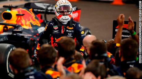 Red Bull&#39;s Max Verstappen celebrates with the team after winning the Abu Dhabi GP. 