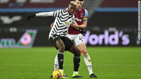 Pogba is challenged by Declan Rice of West Ham United during the Premier League match between West Ham United and Manchester United.