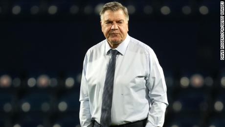 Allardyce watches warm up prior to a Premier League match.