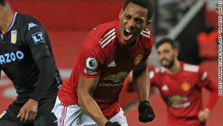 Manchester United&#39;s Anthony Martial celebrates after scoring the opening goal against Aston Villa on Friday, January 1.