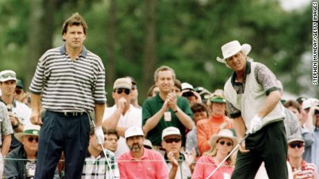 Faldo (left) with playing partner Greg Norman tee off on the first hole during third round of play in the Masters.