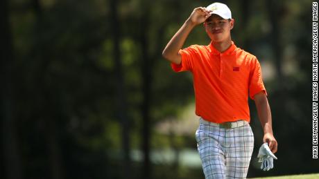 Tianlang Guan walks up the 18th fairway during the second round of the Masters. Guan was given a one-shot penalty following his second shot on the 17th hole for exceeding the when he again exceeded the 40 second time limit.