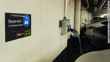 Electric cars charging in a parking lot on March 29, 2019 in Oslo, Norway.