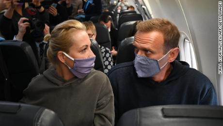 Russian opposition leader Alexey Navalny, right, and his wife, Yulia Navalnya, on a Pobeda airlines plane heading to Moscow before take-off from Berlin on Sunday.