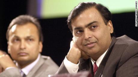 India&#39;s largest private sector company Reliance Industries Chairman and Managing Director Mukesh Ambani (R) along with then Vice Chairman Anil Ambani listen to shareholders opinions at the company&#39;s Annual General Meeting in Mumbai on June 24, 2004. 