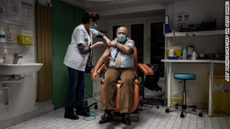 As the world begins its vaccination push, delayed rollouts draw criticism and concern