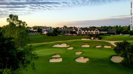 An aerial view of the clubhouse and signature 9th and 18th greens at Southern Hills Country Club.
