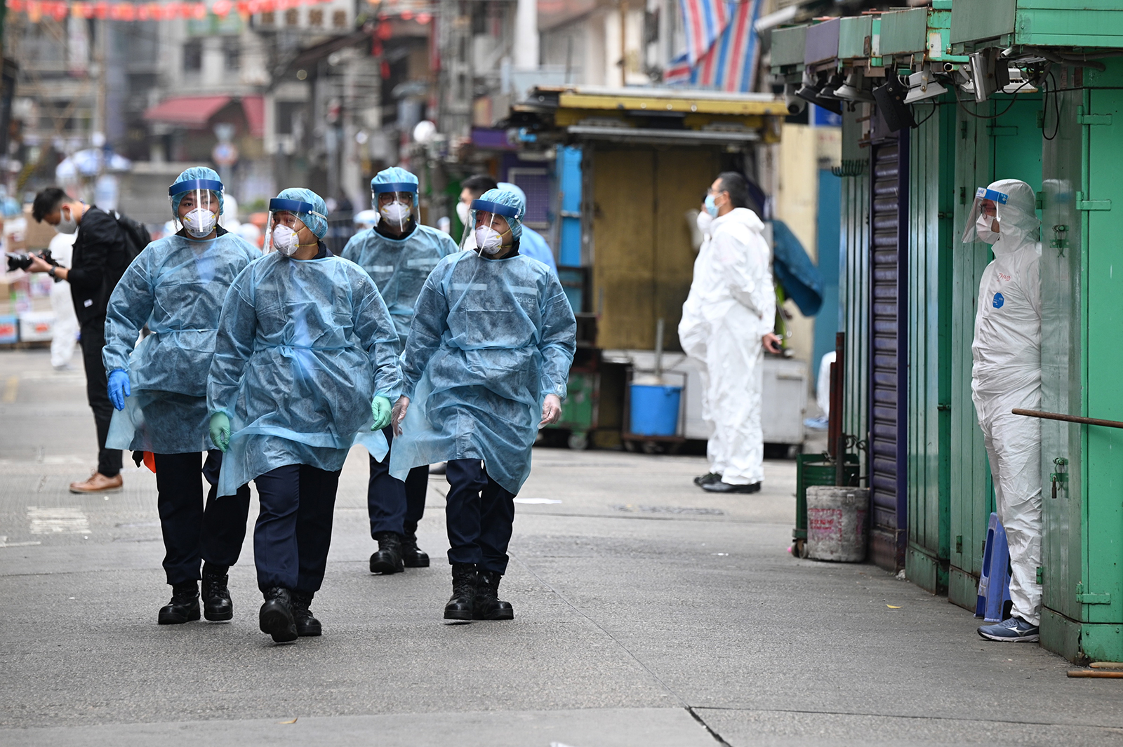 Police patrol the streets while wearing protective gear as authorities continue testing for the second day in the Jordan area of Hong Kong, on January 24.