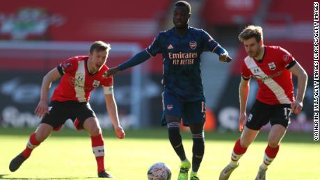 Arsenal&#39;s Nicolas Pepe is challenged by James Ward-Prowse (left) and Stuart Armstrong.