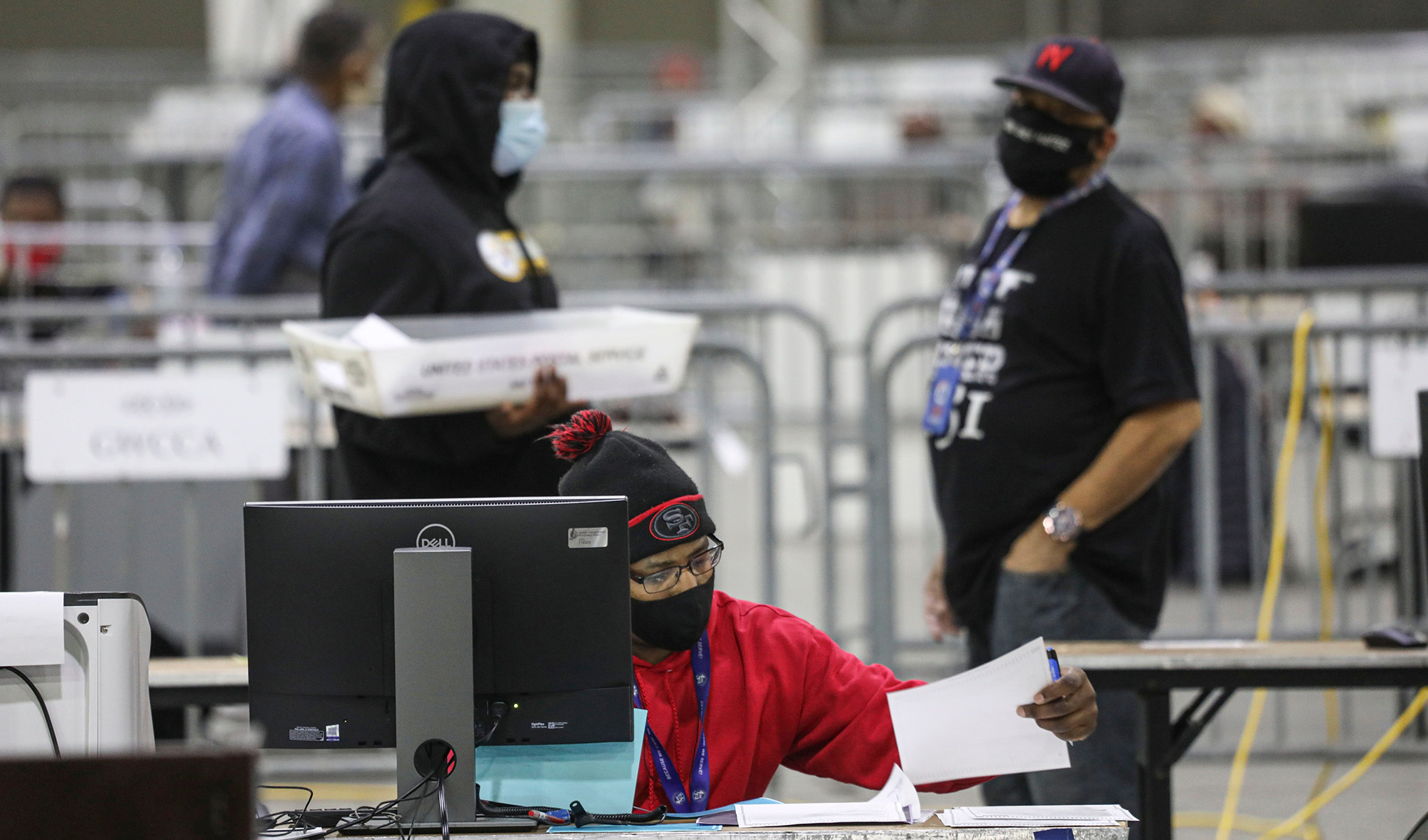 Workers scan ballots at the Georgia World Congress Center in Atlanta, Georgia on January 5, during the Georgia Senate runoff elections. 