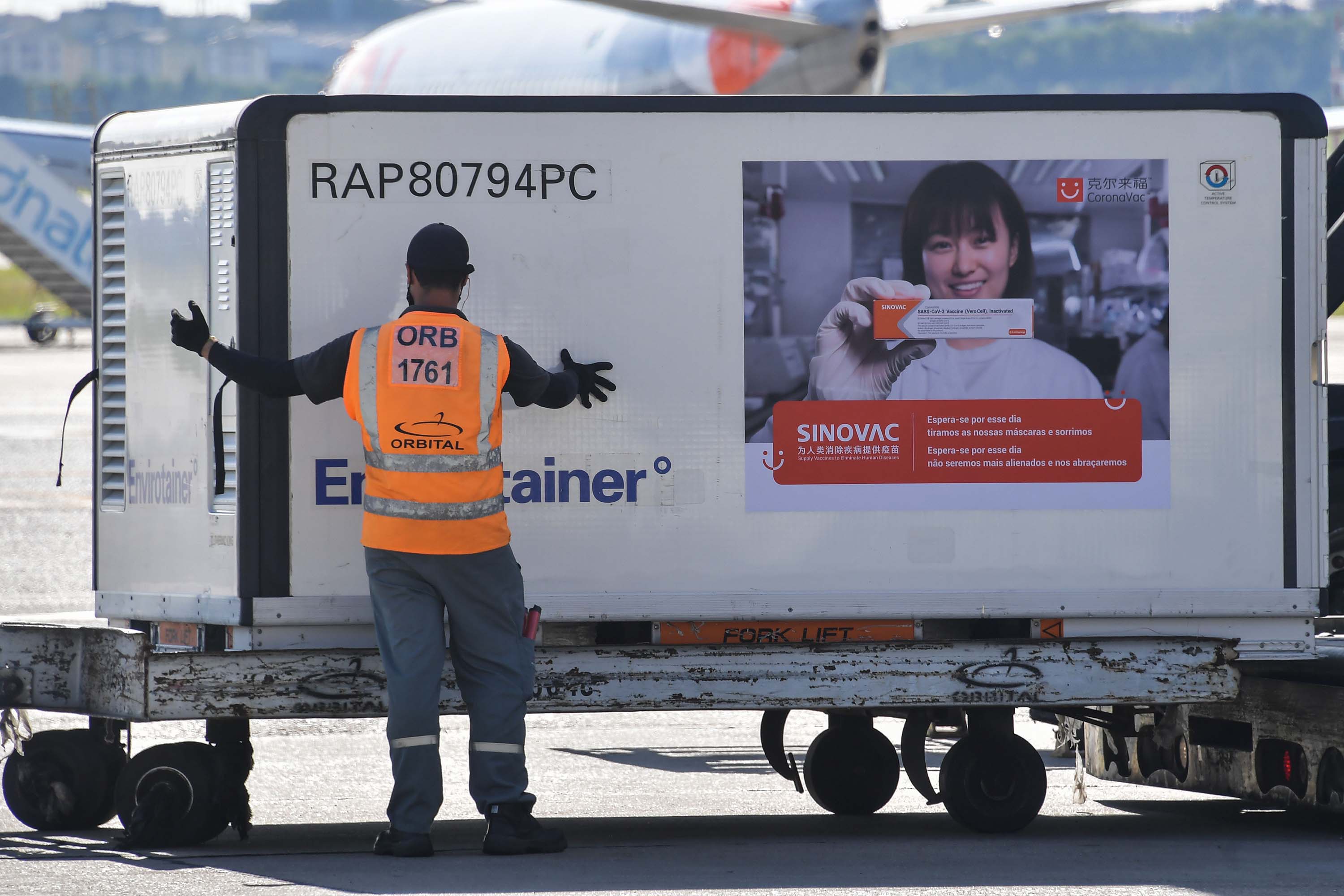 A shipment of the CoronaVac vaccine is unloaded from a cargo plane that arrived from China, at Guarulhos International Airport in Guarulhos, Brazil, on December 18.
