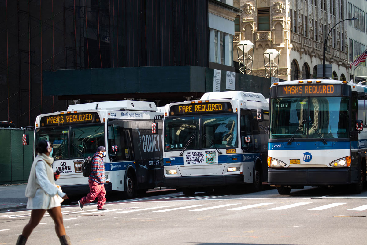 Buses on 5th Avenue display "Mask Required" signs in New York on September 21, 2020.