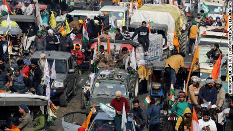 Farmers protest during a tractor rally near the Singhu border crossing in Delhi, India, on January 26, 2021. 