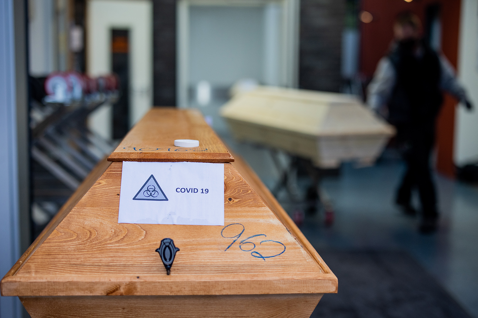A coffin labeled "Biohazard Covid-19" is seen at a crematorium in Dülman, Germany, on January 19.