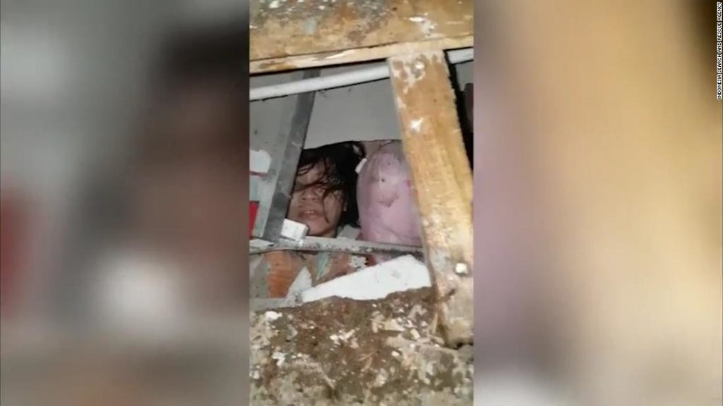 Woman trapped under rubble seen on video