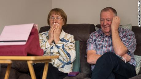 Trish Skinner sits with her husband Peter at home in Northamptonshire as they watch her father&#39;s burial service over Zoom. 